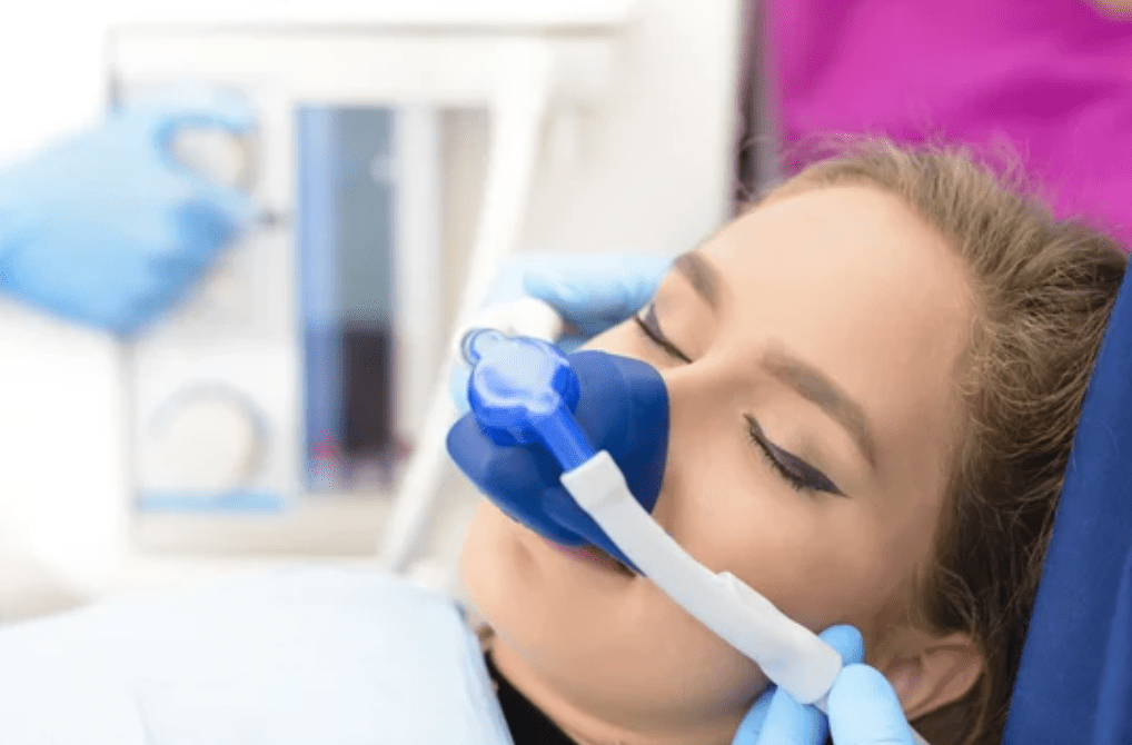 woman receiving nitrous oxide sedation with mask sedation dentistry dentist in Allentown Pennsylvania