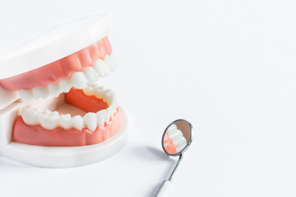 Partial Dentures vs Dental Bridges